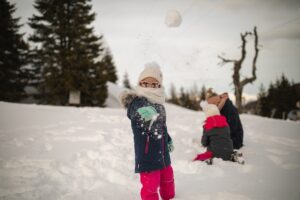 kids playing in the snow in Portugal