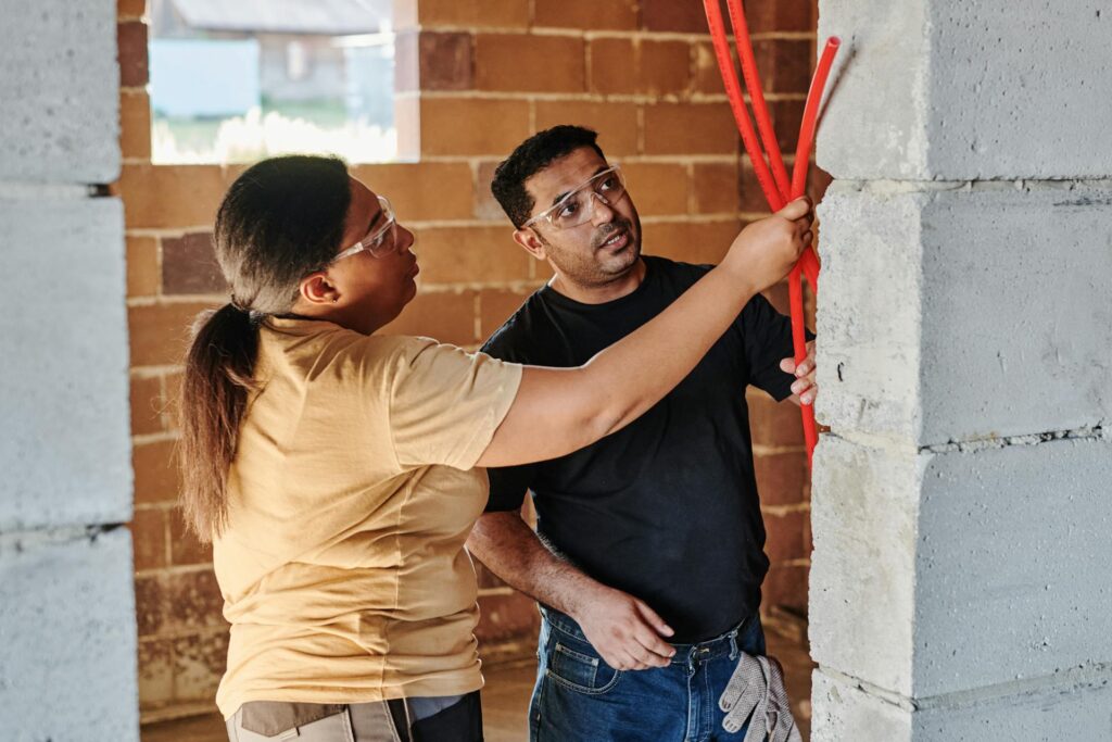 Man inspecting walls during a house inspection